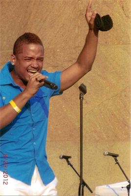 Jose singing and pointing during concert